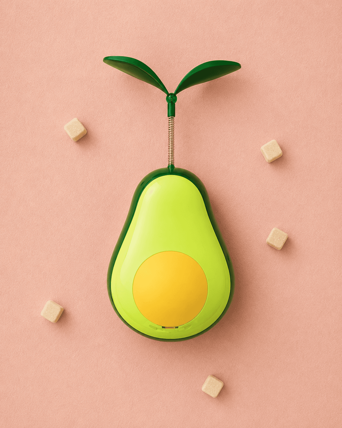 Avocado-shaped treat dispensing tumbler toy